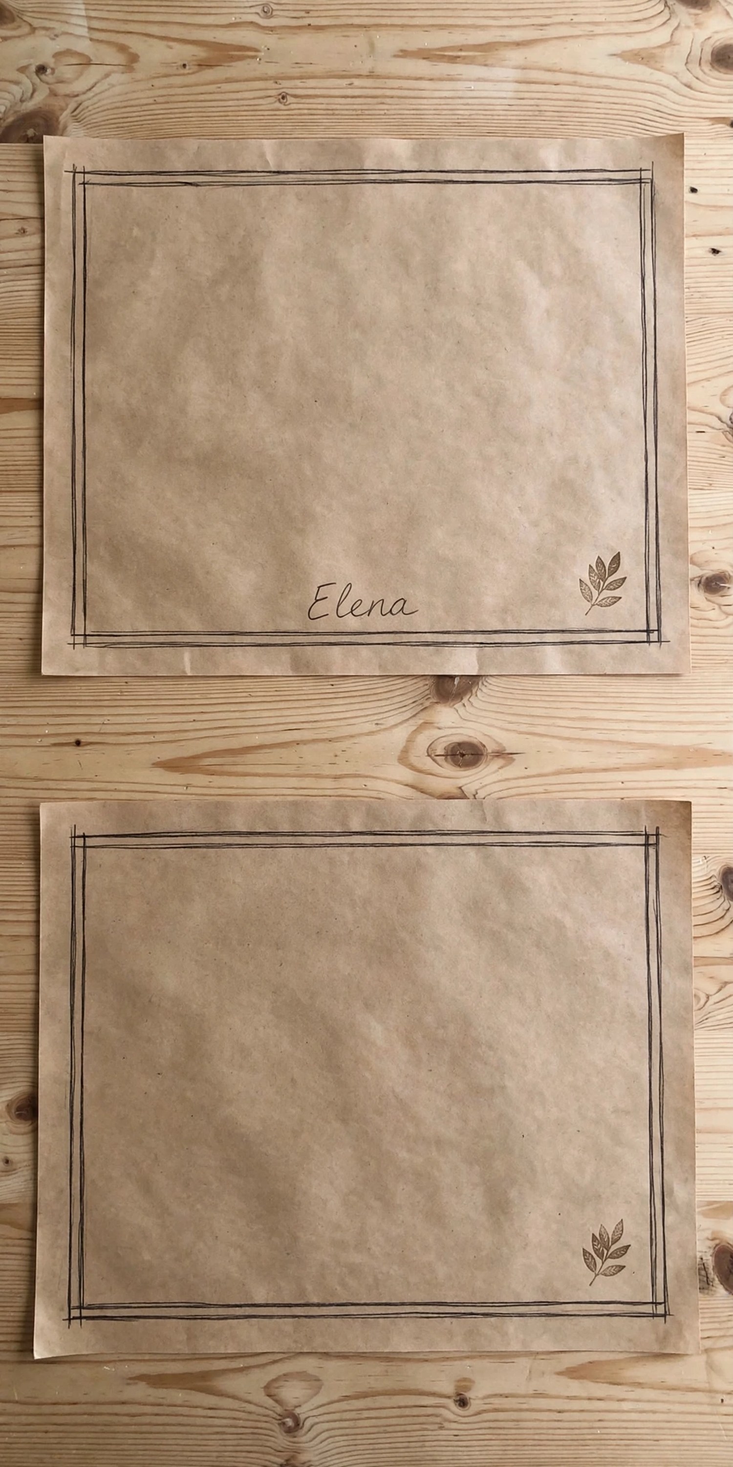 Kraft paper placemats with stamped leaf borders and handwritten names