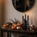 Entryway console table styled with pumpkins, candles, and a small Halloween sign under a mirror